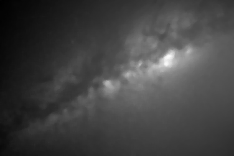 The background of the Milky Way light frame with its stars removed: a bright diagonal band where the galaxy runs, dark upper-left and lower-left corners, and a brighter lower-right corner where light pollution glows